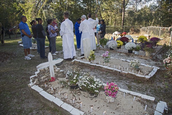 Fr. Kyle Dave leads the Blessing of the Graves at Ducre Cemetery on All Saints Day