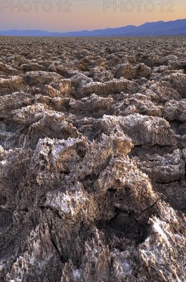 Salt crusts at the Devil's Golf Course at sunset