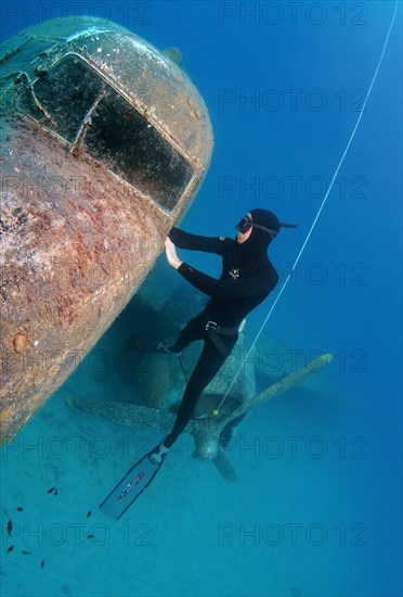 Freediver at plane wreck Douglas DC-3 'Dakota'