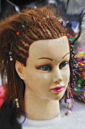 Head of a fashion doll with braids