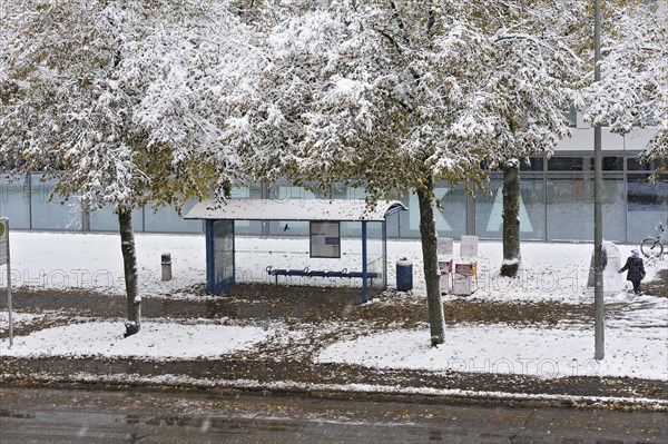 A snow covered bus stop