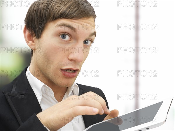 Businessman working on an iPad