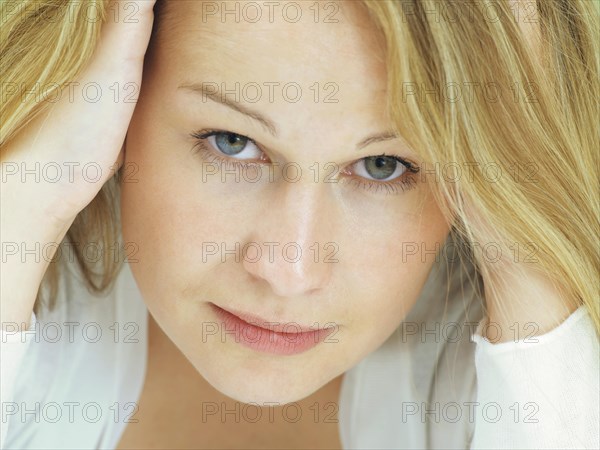 Portrait of a young woman with a serious face