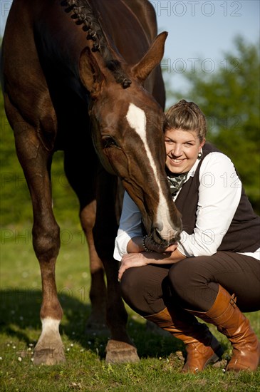 Woman with a Hanoverian horse