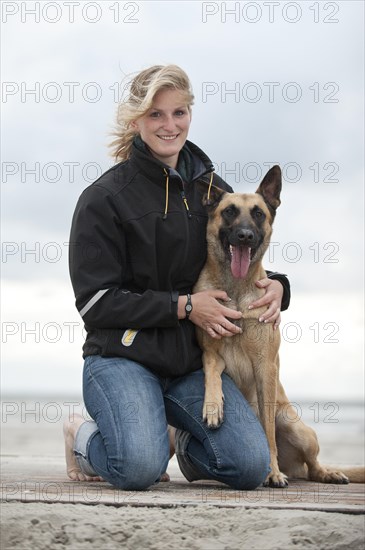 Woman with a Hollandse Herdershond