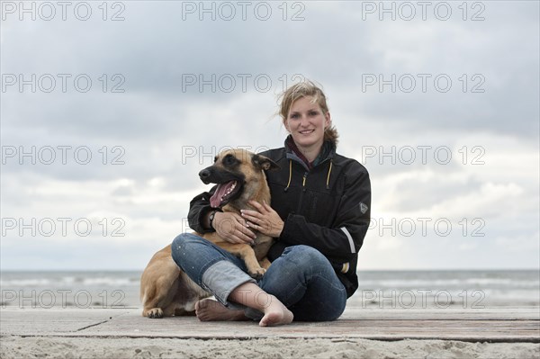 Woman with a Hollandse Herdershond