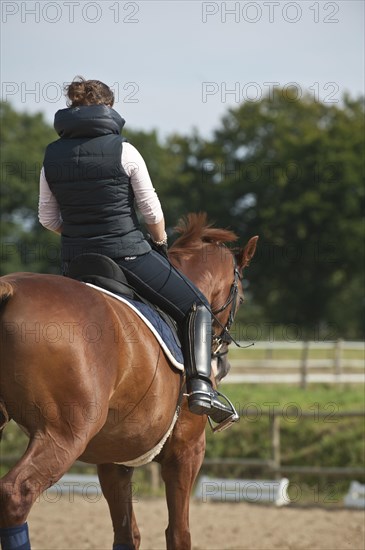 Woman riding a horse