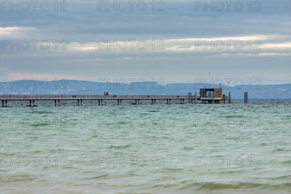 The pier at sunrise in Altnau on Lake Constance