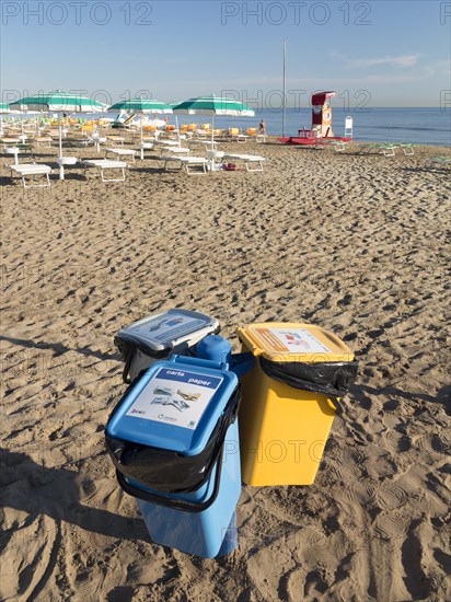 Recycling bins on a beach in Riccione