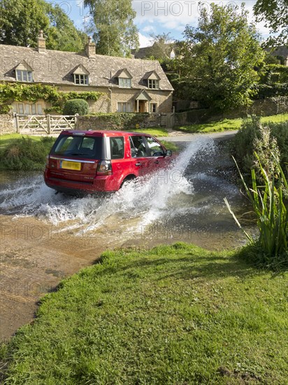 Land rover Freelander crossing a stream