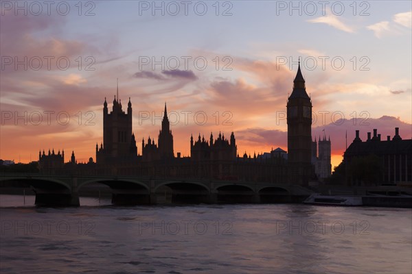 The Houses of Parliament and Westminster Bridge silhouetted at dusk