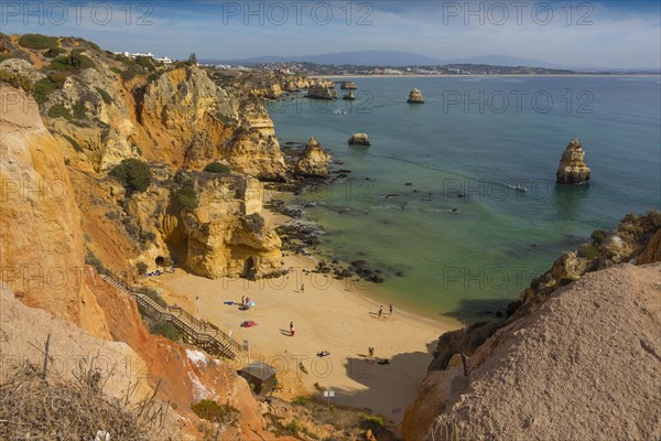 Praia do Camilo beach with Praia Dona Ana beach at back