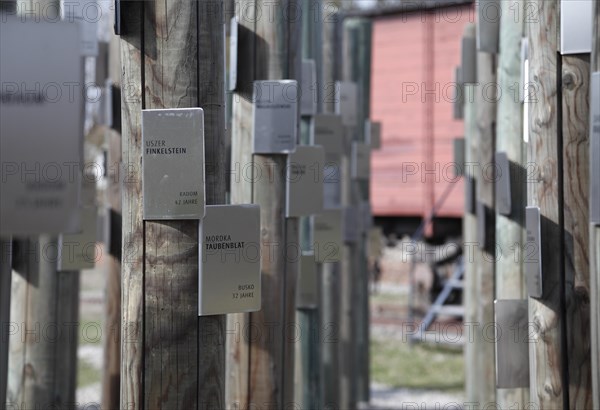 Poles with name tags of Jewish prisoners