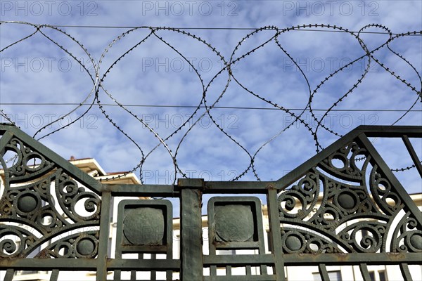 Barbed wire around abandoned building