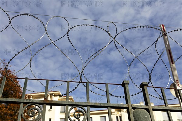 Barbed wire around abandoned building