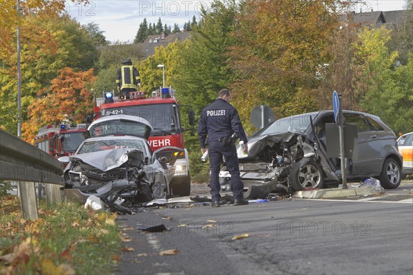 Policeman marking an accident site with a spray can