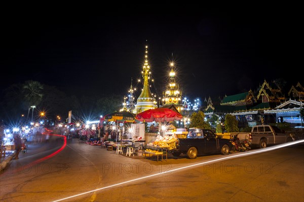 Night market outside the temple complex of Wat Jong Kham or Chong Kham and Wat Jong Klang or Chong Klang