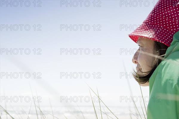 A woman sitting on the beach