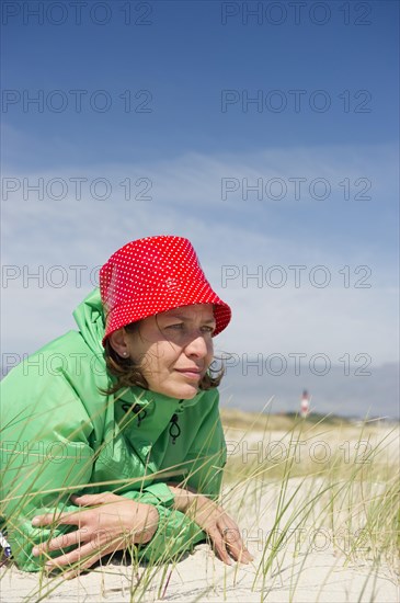 Woman lying on the beach