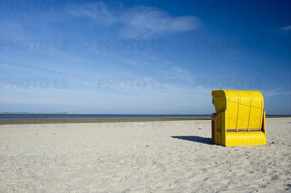 Yellow roofed wicker beach chairs on the beach near Utersum