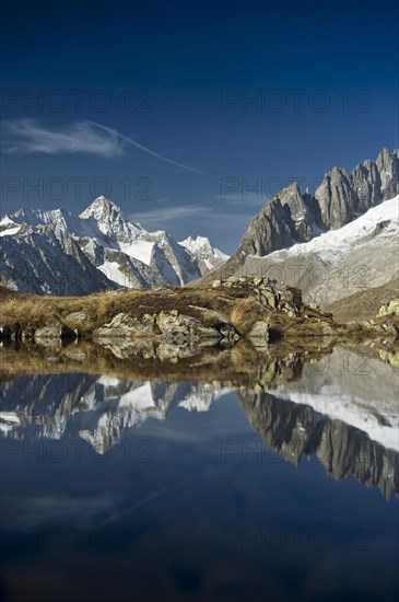 Small lake above the Aletsch Glacier and the Bernese Oberland