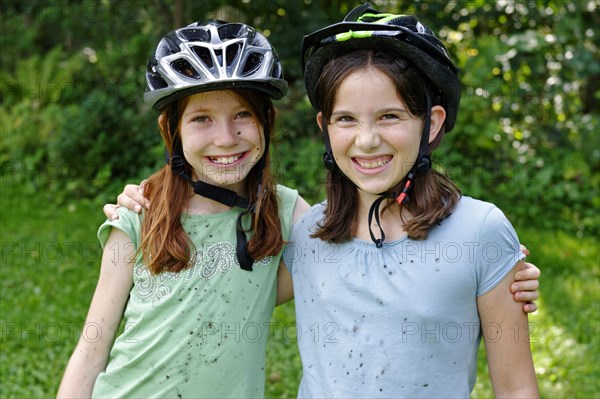Girls wearing cycle helmets