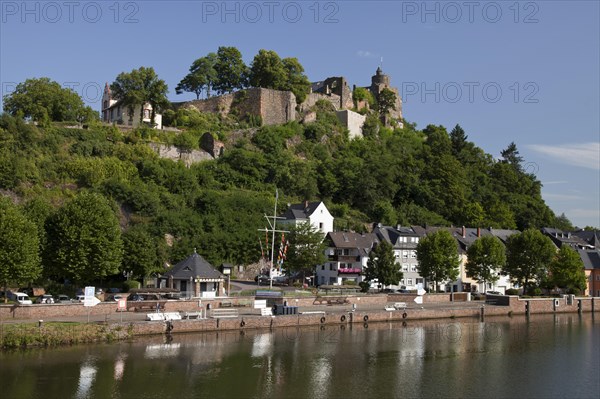 Saar shore with pier and above the Saarburg castle ruins