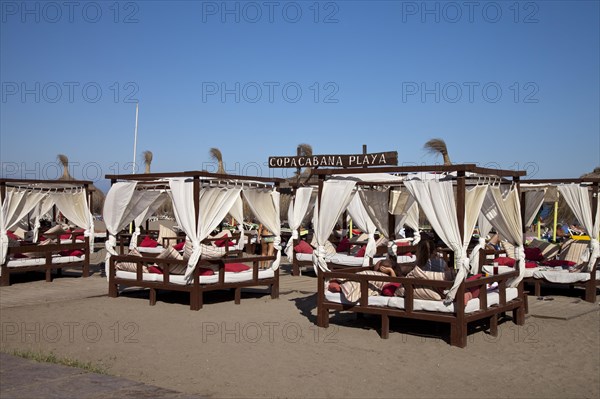 Sunbeds on the Copacabana Playa beach