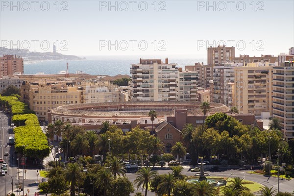 View from Alcazaba Fortress towards the coast with skyscrapers and a bullring