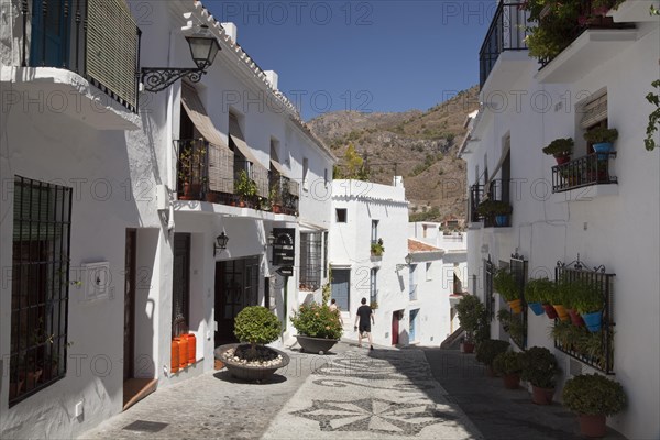 White houses in a narrow alley in Frigiliana