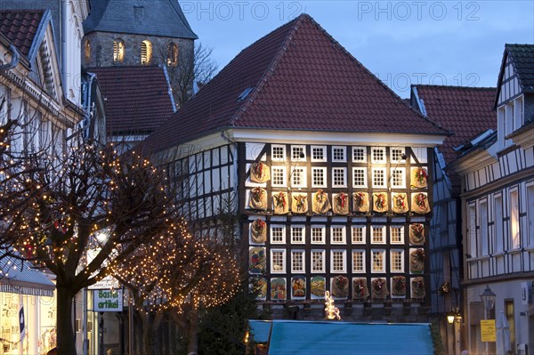 Advent calendar on the facade of the old town hall in the old town at dusk