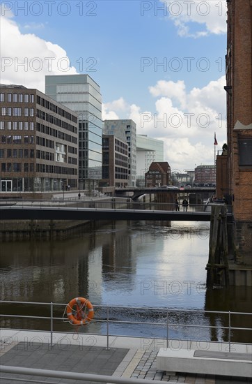 Modern office buildings at Brooktorhafen harbour with Museumsbruecke bridge