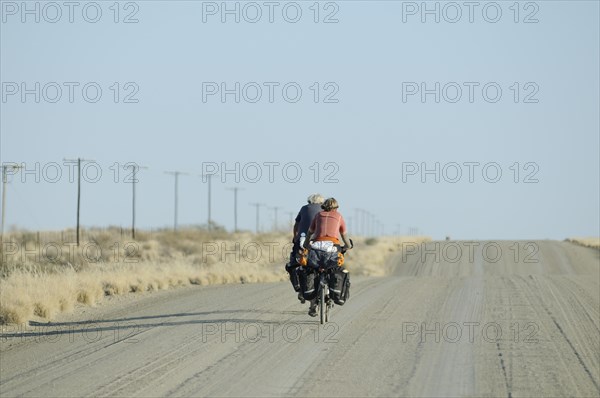 Cyclists on a dusty track