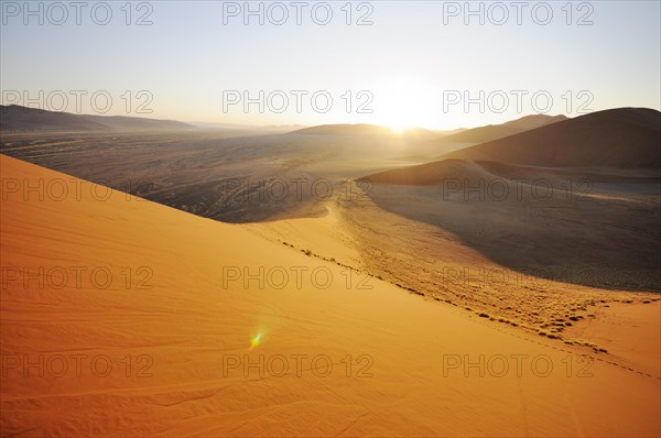 Sunrise view from Dune 45 on a desert landscape with dunes