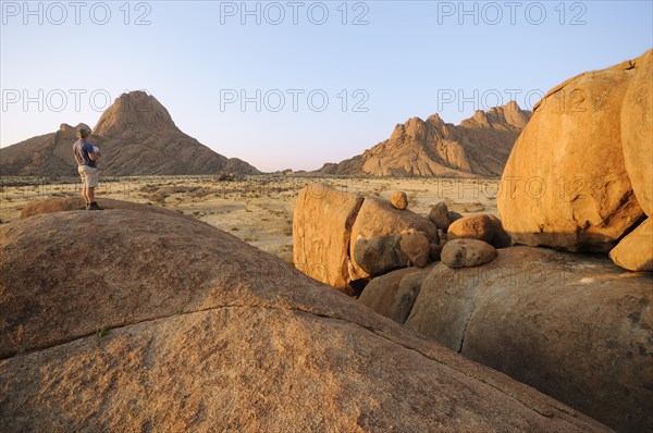 Savannah landscape in the evening sun with rock formations