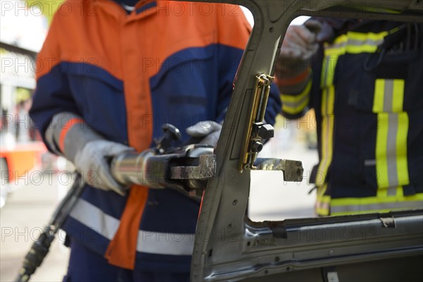 Firefighter working with hydraulic rescue equipment