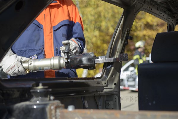 Firefighter working with hydraulic rescue equipment