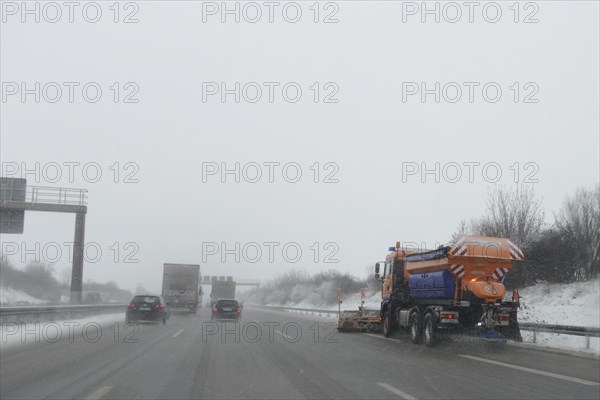 Snow-clearing vehicle from the motorway maintenance authorities in operation on the A8 motorway