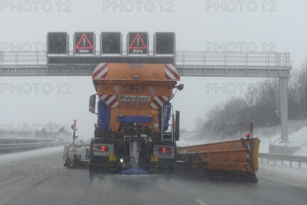 Snow-clearing vehicle from the motorway maintenance authorities in operation on the A8 motorway