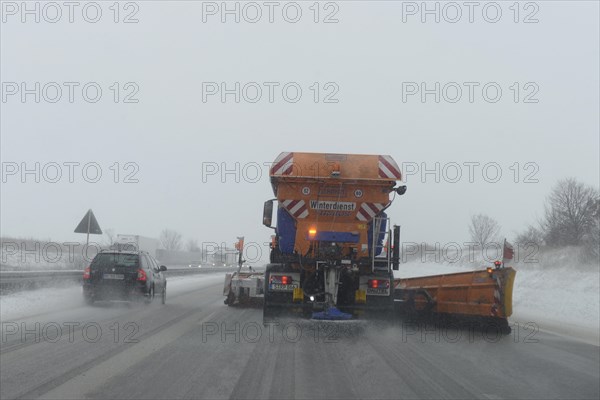 Snow-clearing vehicle from the motorway maintenance authorities in operation on the A8 motorway