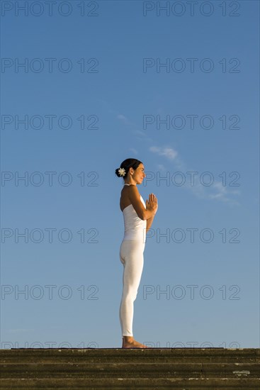 Young woman practising Hatha yoga