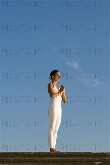 Young woman practising Hatha yoga