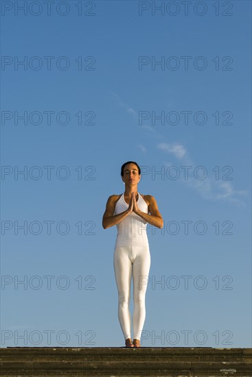 Young woman practising Hatha yoga