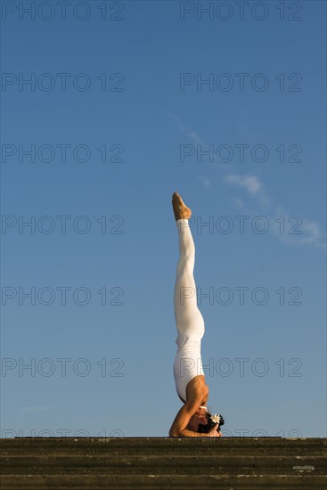 Young woman practising Hatha yoga