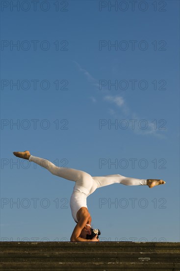 Young woman practising Hatha yoga