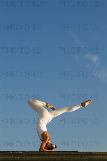 Young woman practising Hatha yoga