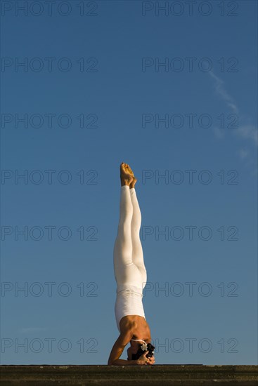 Young woman practising Hatha yoga