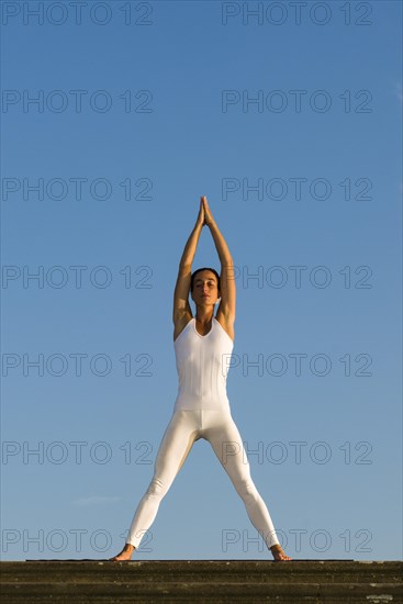 Young woman practising Hatha yoga