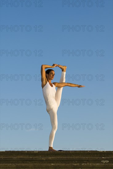 Young woman practising Hatha yoga