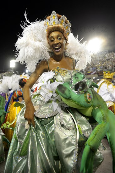 Female dancer dressed in the costume of the princess from the fairy tale "Frog King" by the Brothers Grimm